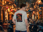 Person wearing a t-shirt with a colorful design of geckos in a lively street setting in Southeast Asia