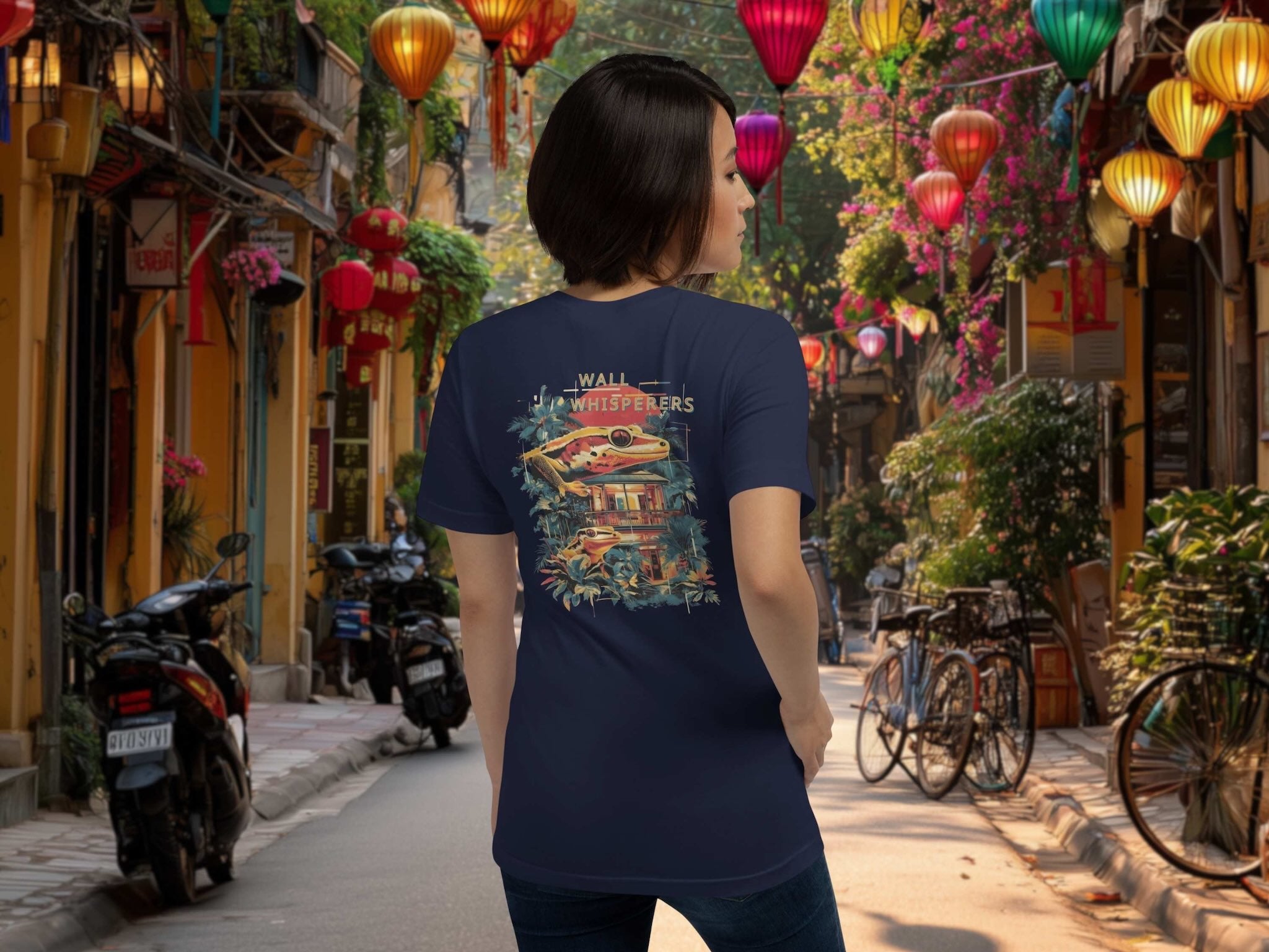 Wall Whisperers Saigon gecko back print blue t-shirt on a woman in the street of Hoi An, Vietnam