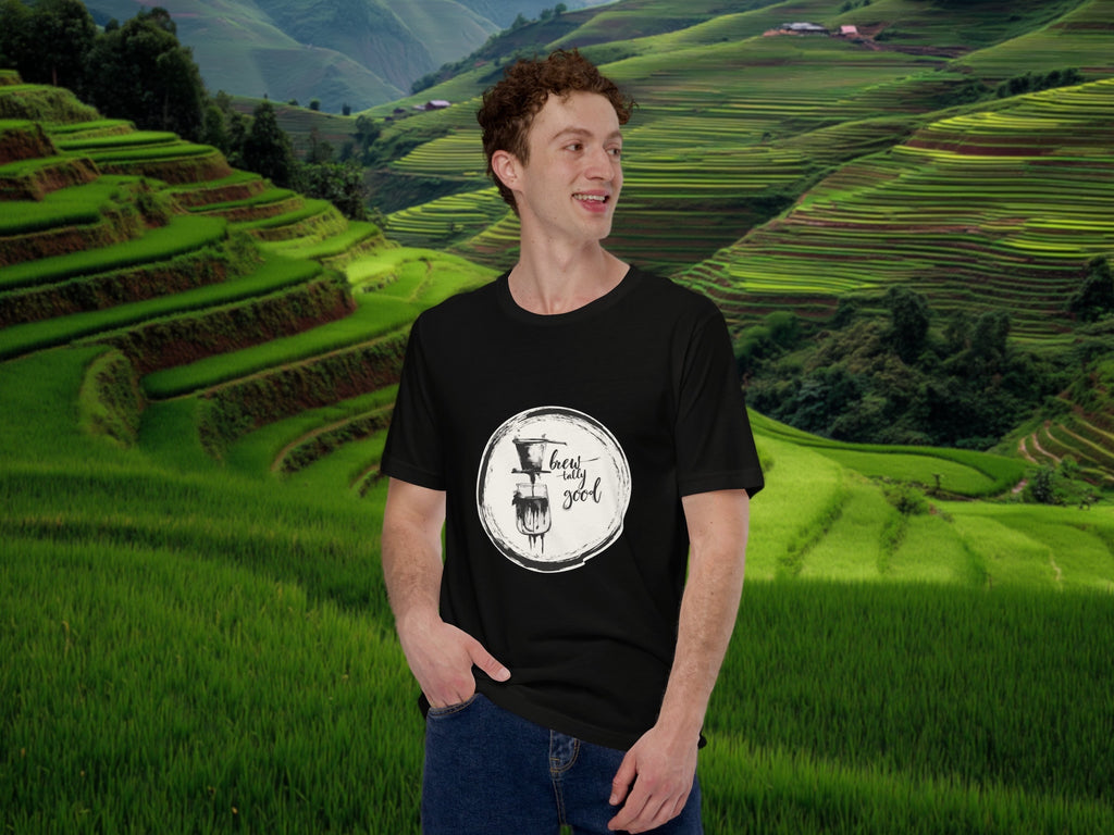 Model wearing Brewtally Good t-shirt in calm rice field lifestyle scene