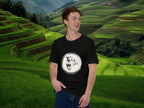 Model wearing Brewtally Good t-shirt in calm rice field lifestyle scene