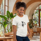 Woman wearing a white t-shirt with a coffee graphic design in a aesthetic cafe in Bali