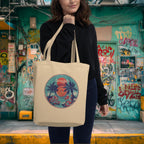 Woman holding an organic cotton eco tote bag with tropical dragon vinyl-style graphic print