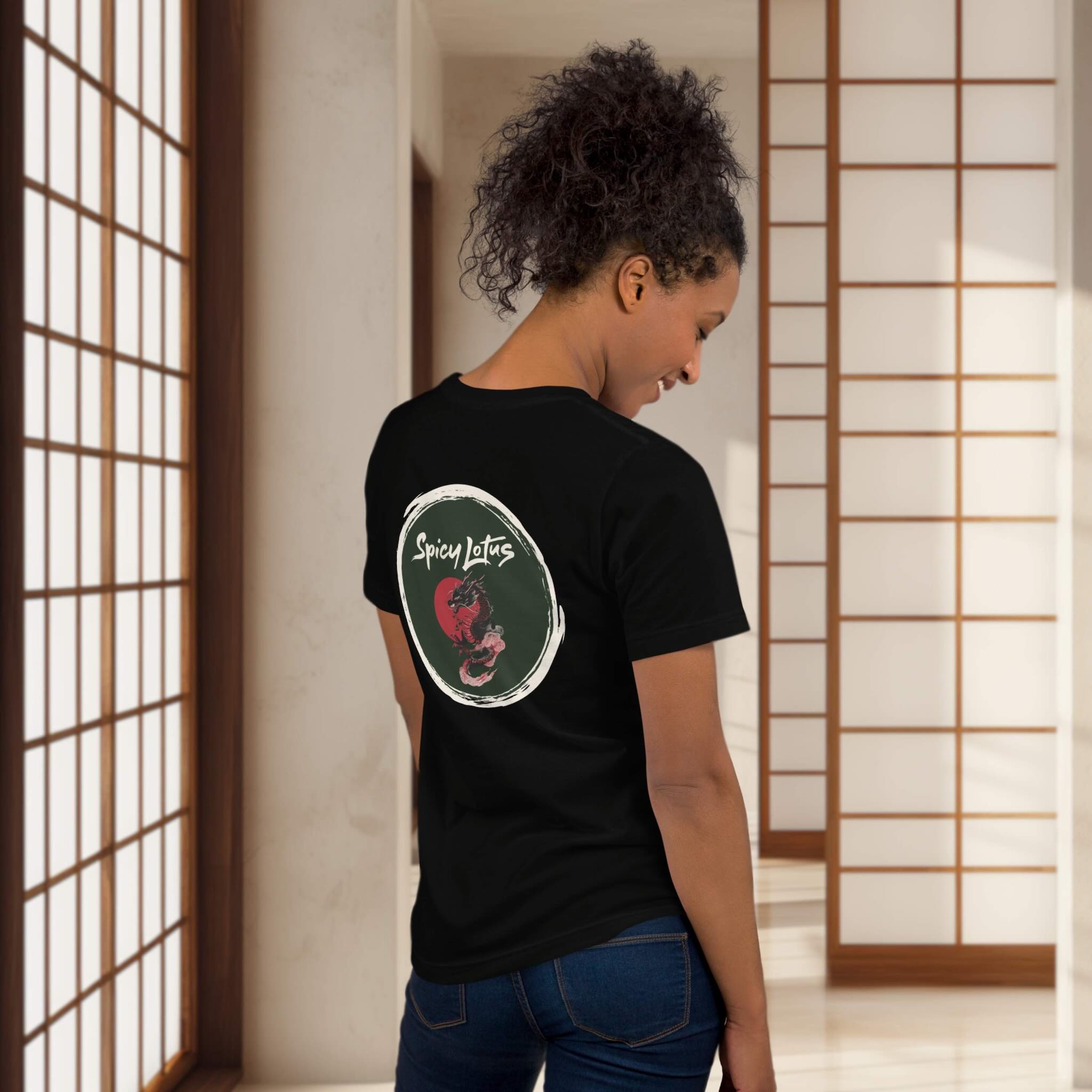 Person wearing a black t-shirt with a dragon enso design on the back in a room with wooden sliding doors.