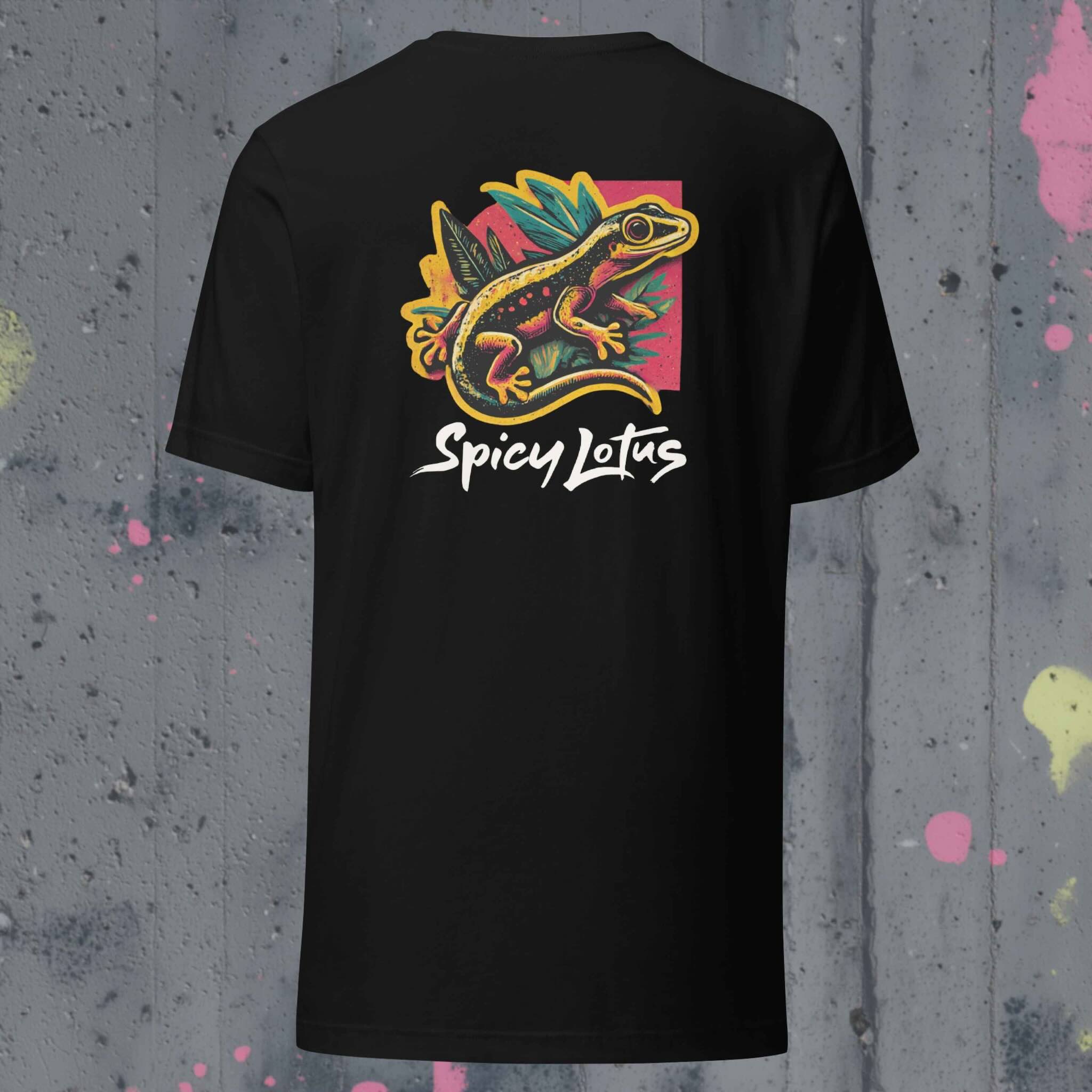 Black t-shirt with colorful gecko graphic and 'Spicy Lotus' text on a textured gray background