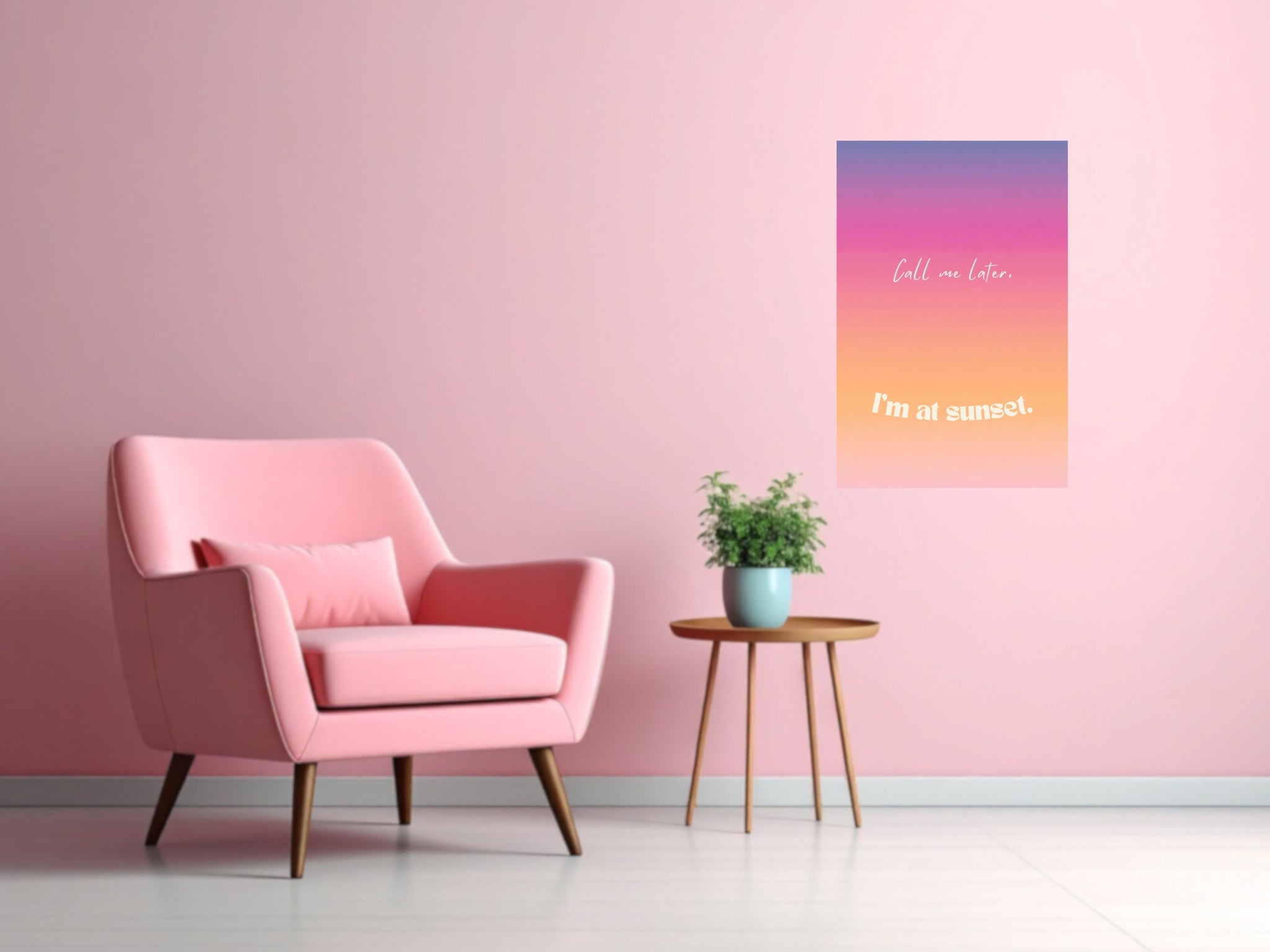 Pink armchair in a room with a colorful wall art print on a pink wall.
