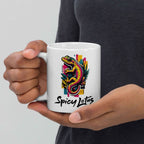 Person holding a white mug with a colorful gecko design and 'Spicy Lotus' text.
