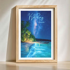 Tropical night landscape art print with glowing blue shoreline in wooden frame