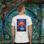 Island Dons Komodo Nights back print t-shirt on a young man in front of painted wall