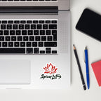 Laptop with Spicy Lotus logo kiss cut sticker, smartphone, pencil, and pen on a white surface