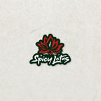 Spicy Lotus logo, red lotus flower with green sticker frame and white font on a textured white background