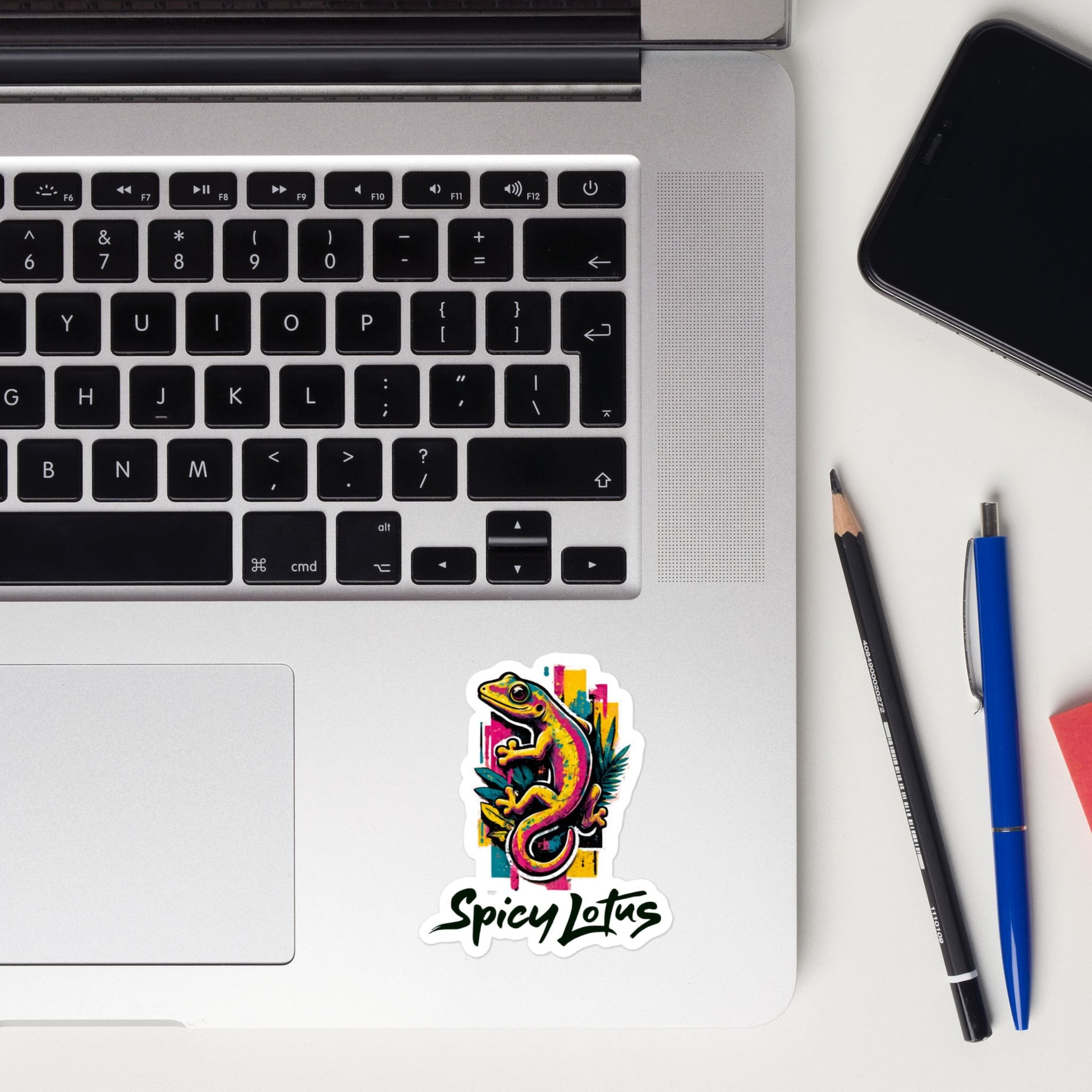Colorful sticker with 'Spicy Lotus' logo on a laptop