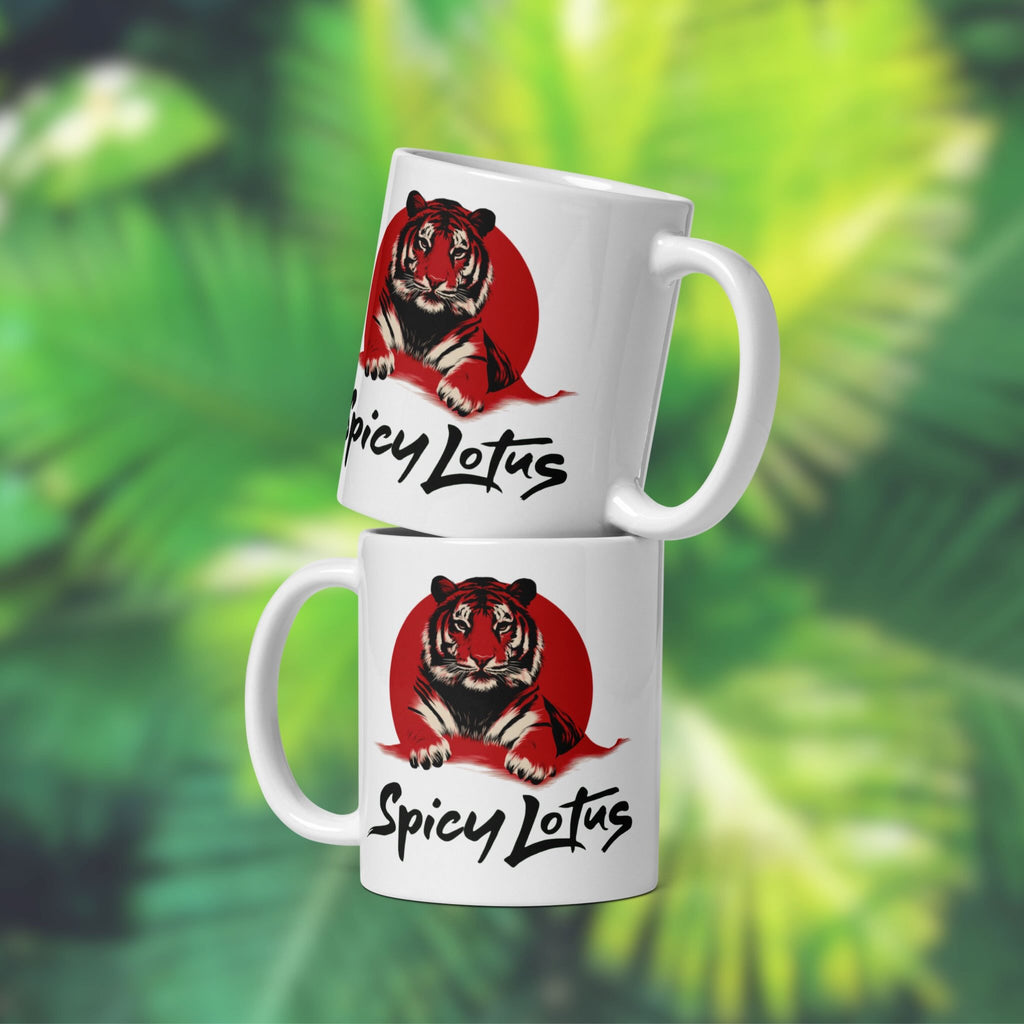 Two white mugs with a tiger design and 'Spicy Lotus' text on a green leafy background