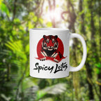 White mug with a tiger design and 'Spicy Lotus' text against a green forest background