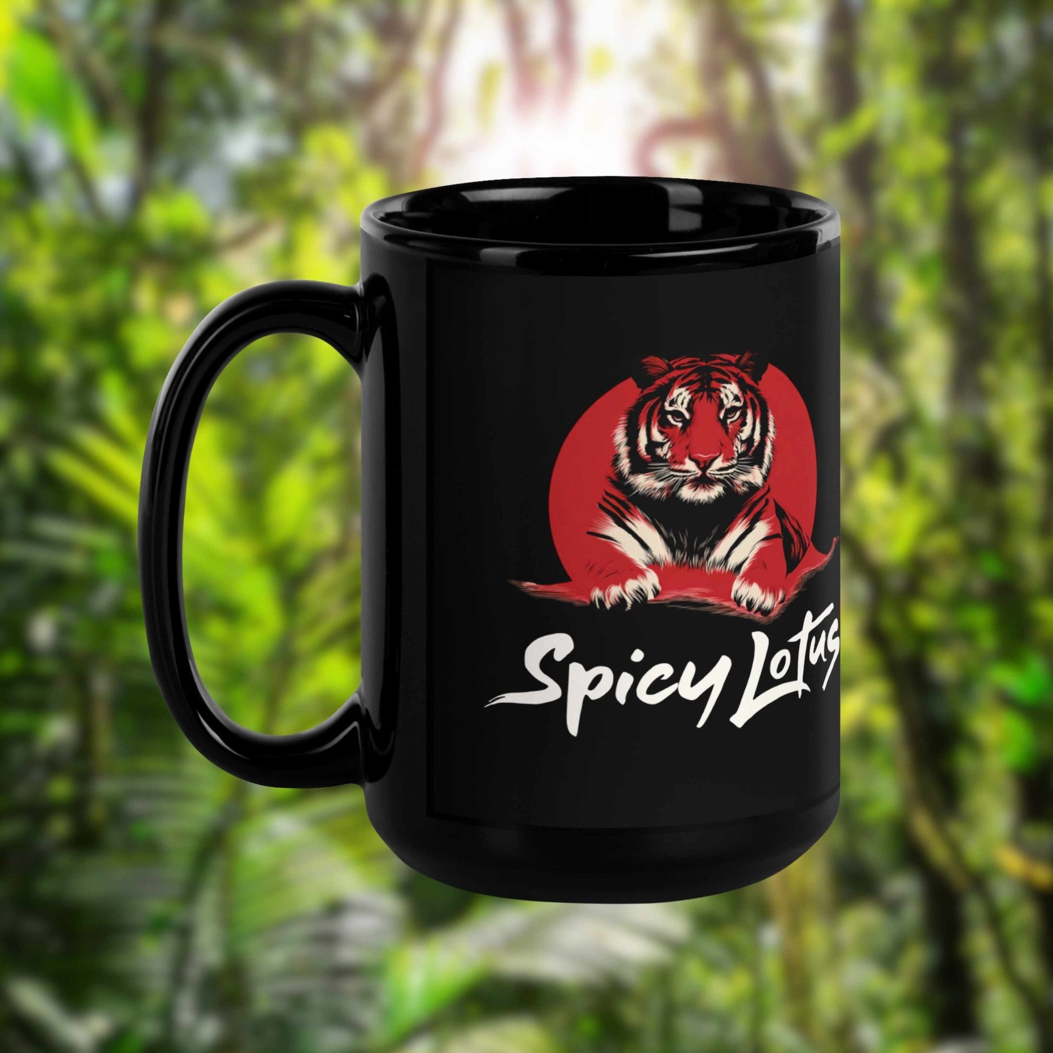 Black 15 oz mug with a tiger logo and 'Spicy Lotus' text against a blurred green foliage background