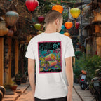 Person wearing a white t-shirt with a colorful graphic of vietnamese summer rolls on the back, standing in an outdoor setting with lanterns.