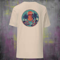 Beige t-shirt with a colorful vinyl graphic on the back against a textured purple and gray background