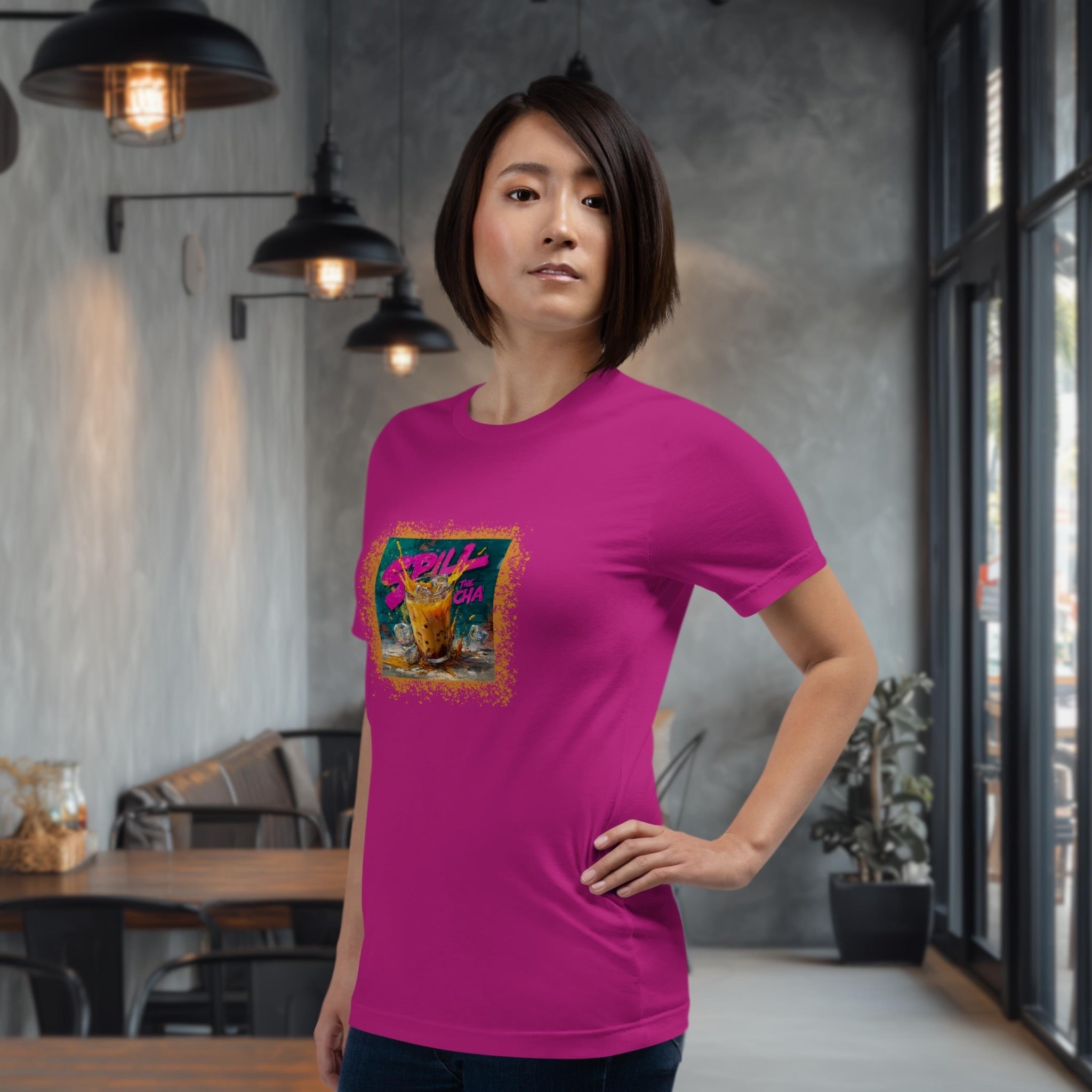 Model wearing Spill the Cha t-shirt in urban cafe setting
