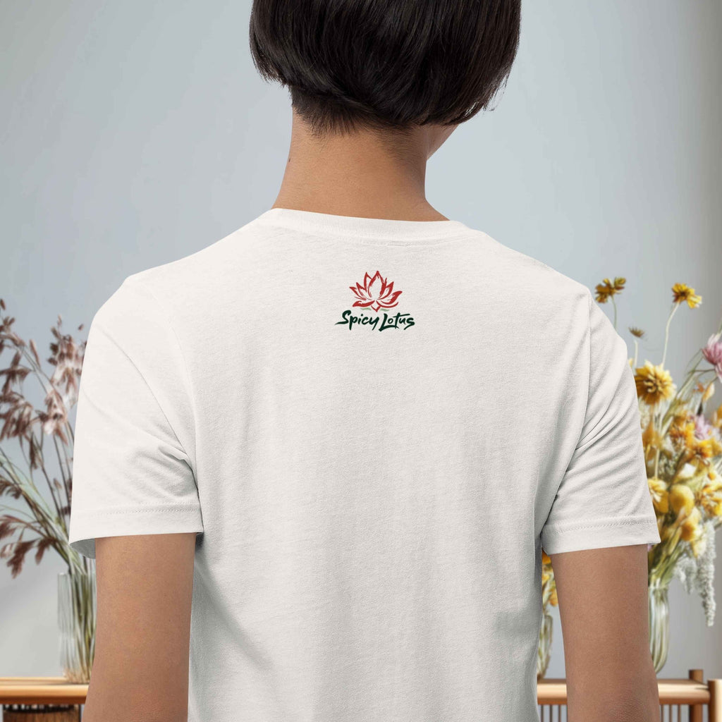 Person wearing a white t-shirt with 'Spicy Lotus' logo on the back, standing against a light gray background with floral decorations.