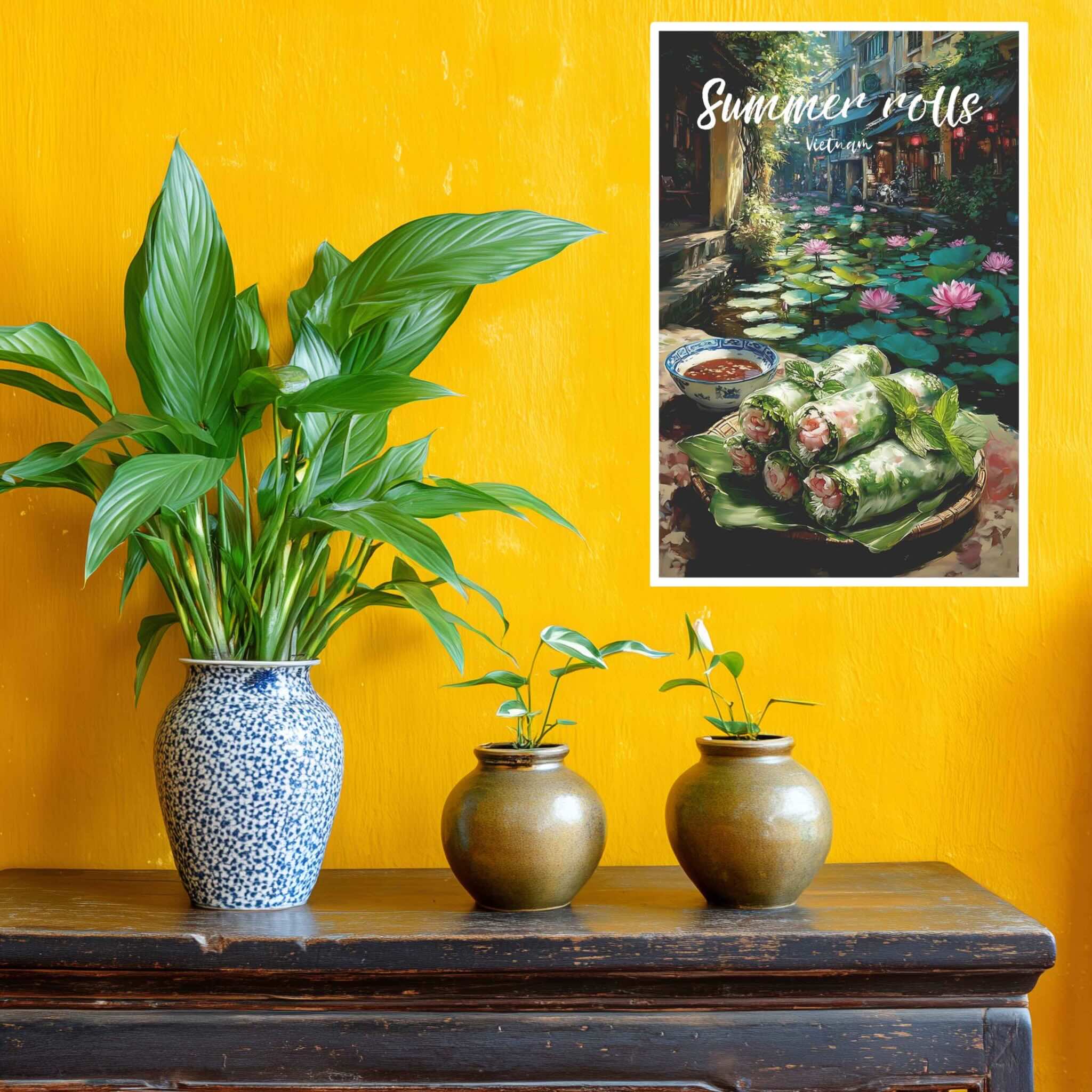 Three potted plants on a wooden table with a yellow wall and a poster of Vietnamese spring rolls.