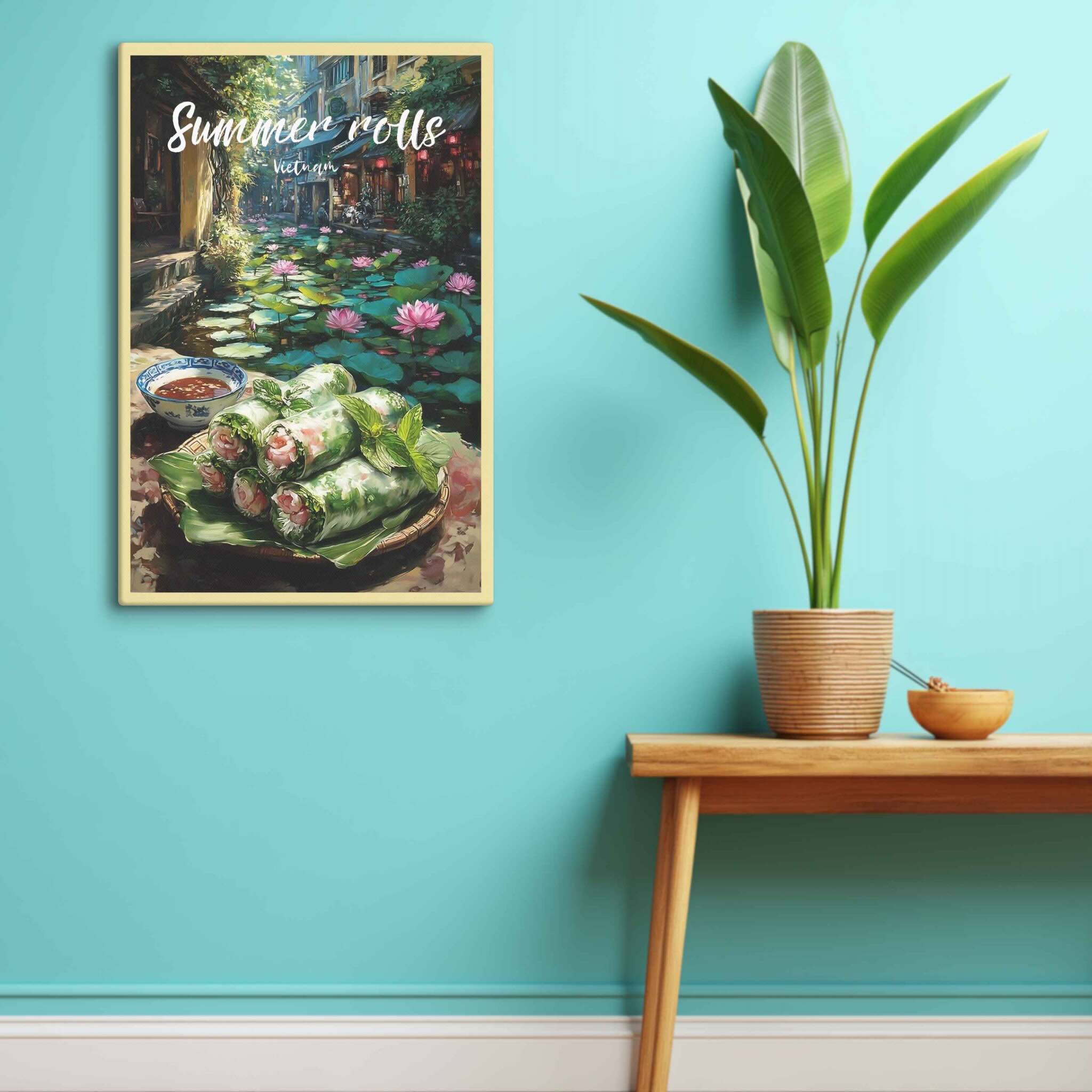 Framed artwork of summer rolls with a garden scene on a teal wall above a wooden table.