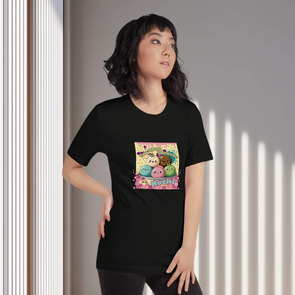 Person wearing a black t-shirt with colorful graphic design of cute mochis