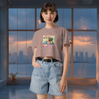 Person wearing a t-shirt with a colorful graphic design of a group of mochis in a room with large windows showing a cityscape.
