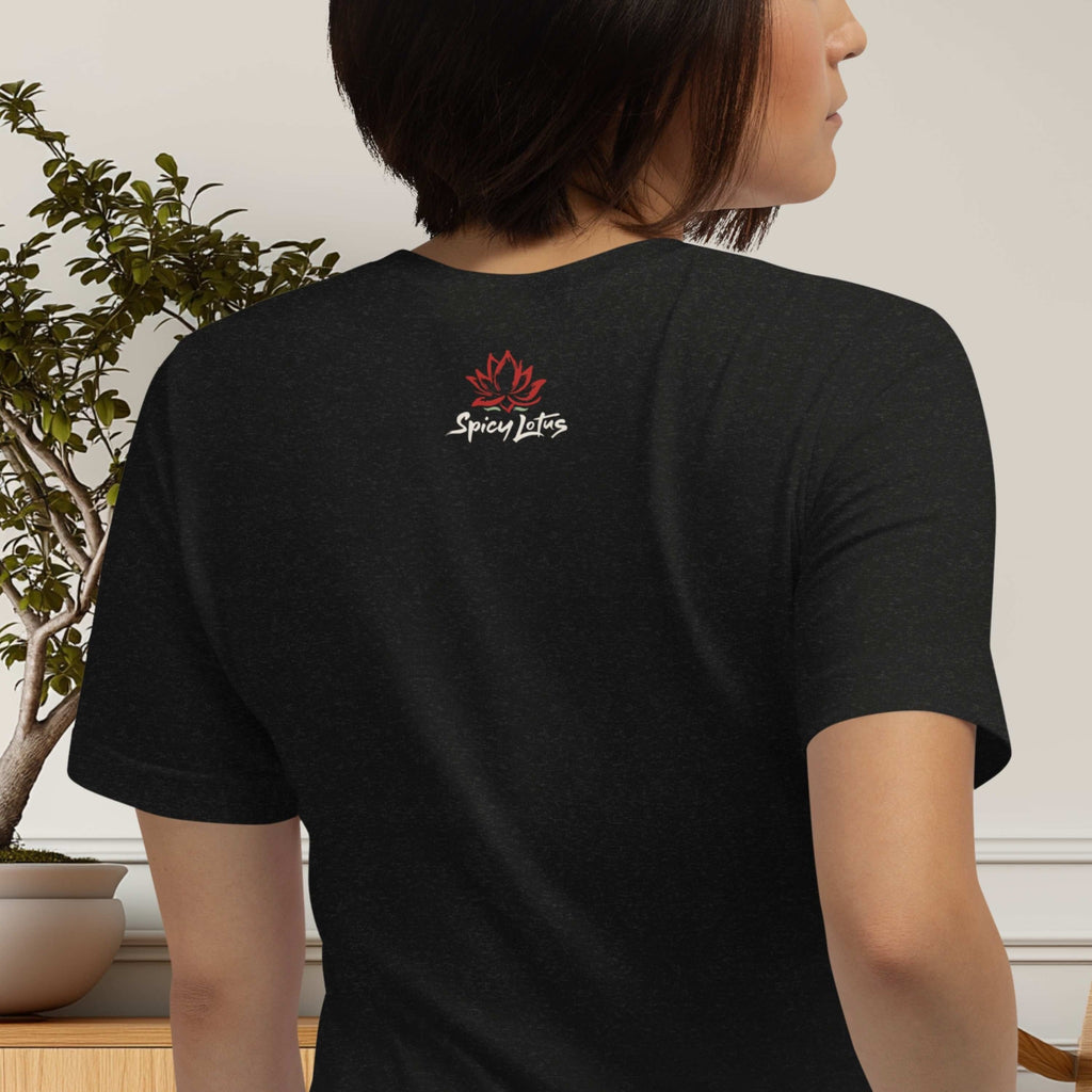 Person wearing a black t-shirt with a logo on the back, standing indoors.