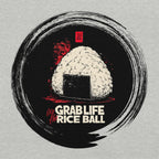 Close-up DTG print of bold onigiri illustration with red brush accents