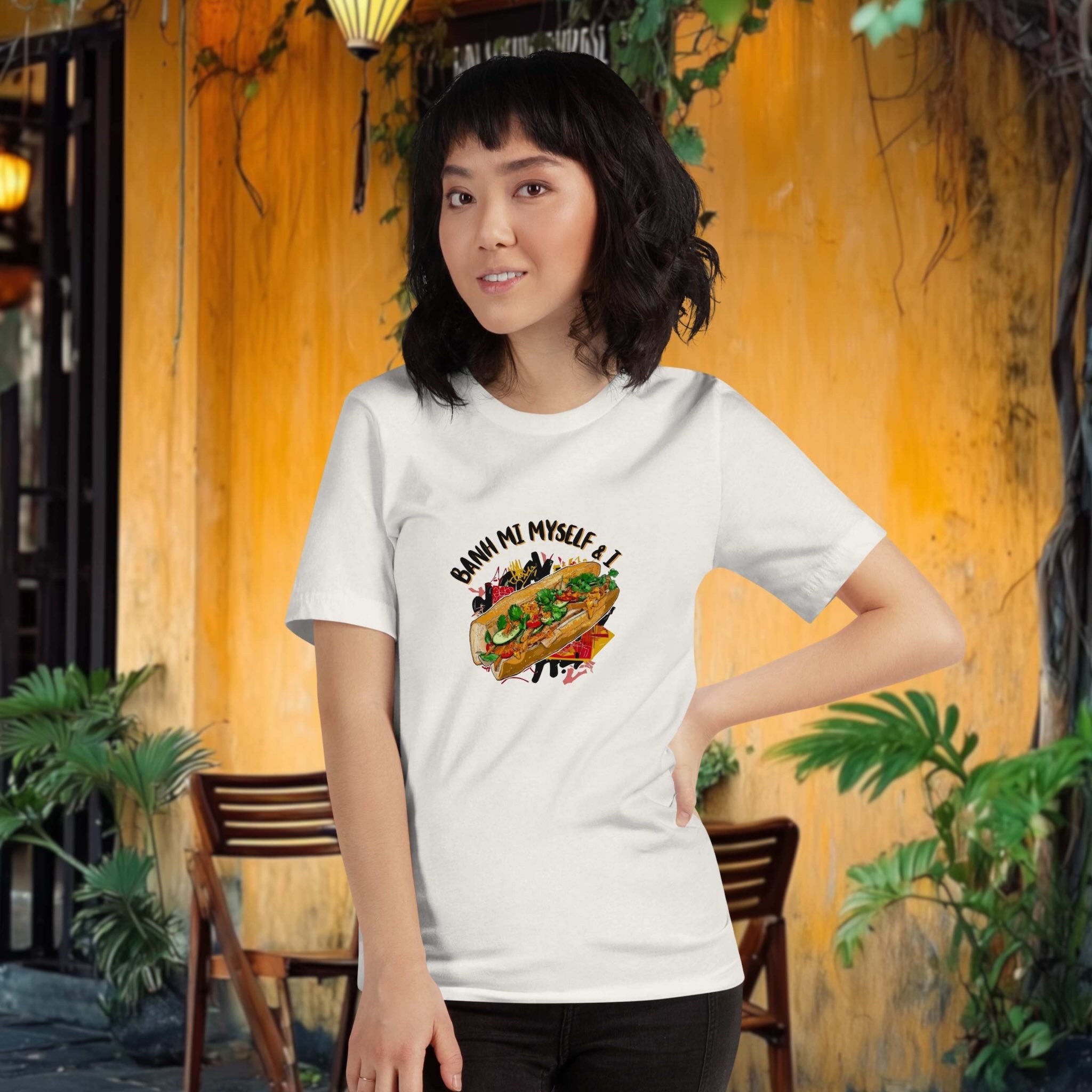 Model wearing Banh Mi Myself & I t-shirt in urban street food setting