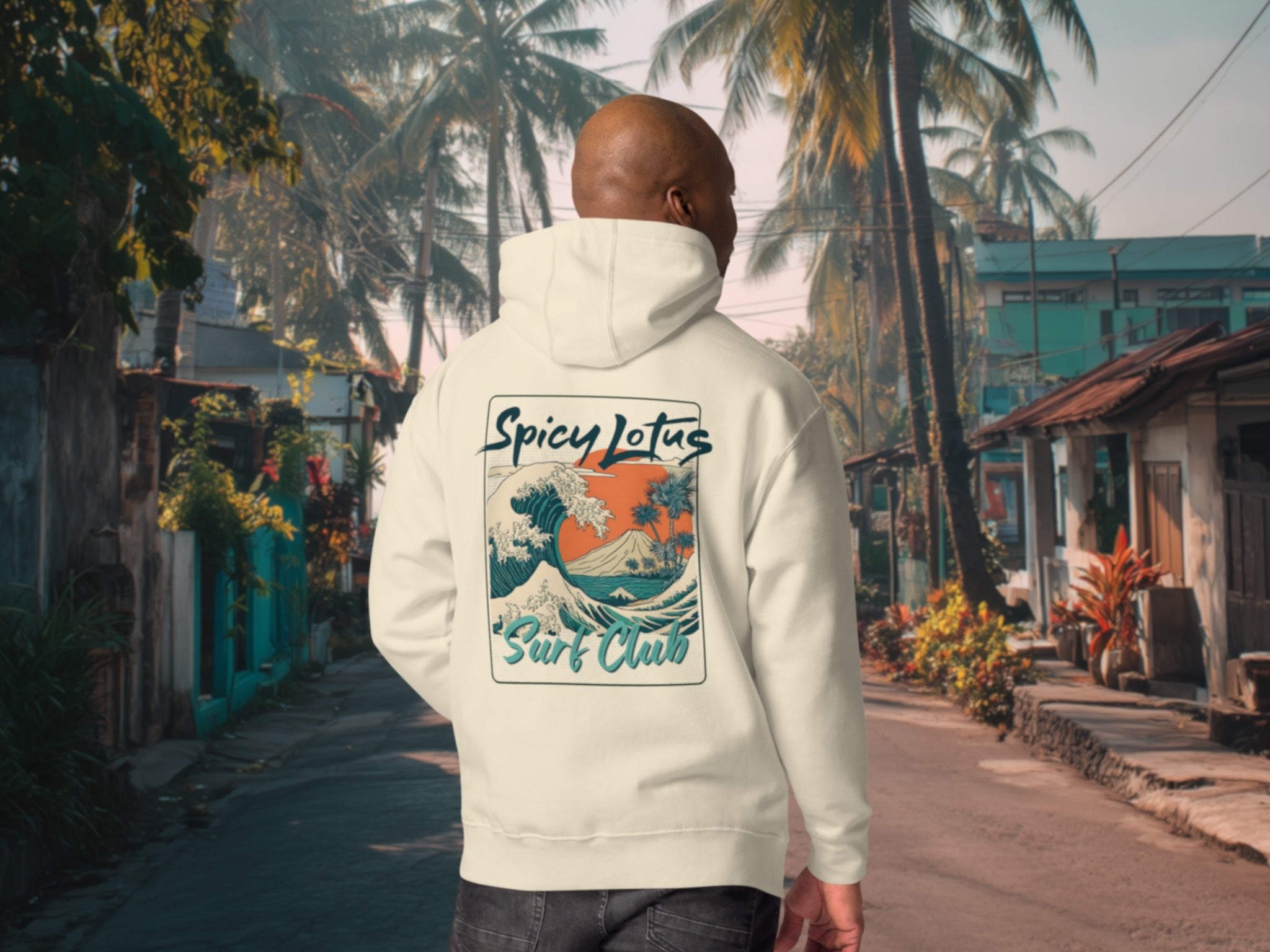 Person wearing a hoodie with a 'Spicy Lotus Surf Club' design in a tropical street setting.