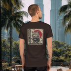 Man standing in front of the Petronas Towers in Kuala Lumpur wearing a Spicy Lotus Zen Tiger back print tee in brown