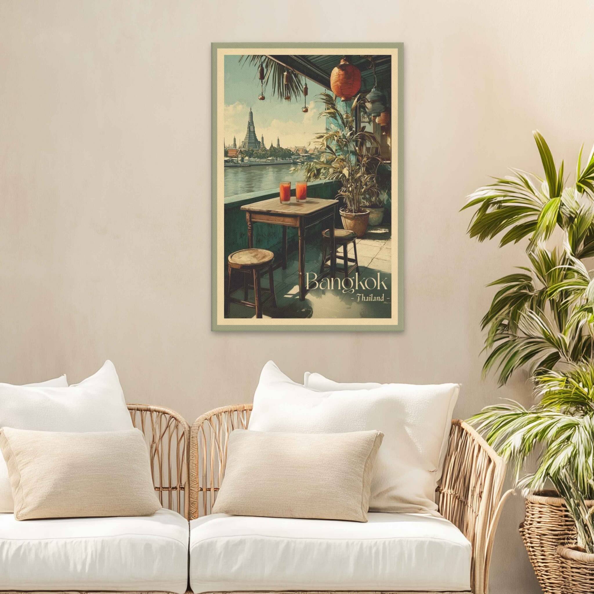 Framed artwork of a street scene in Bangkok on a wall above a sofa with decorative pillows.